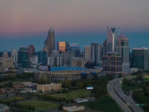 The interstate running into Charlotte at dusk